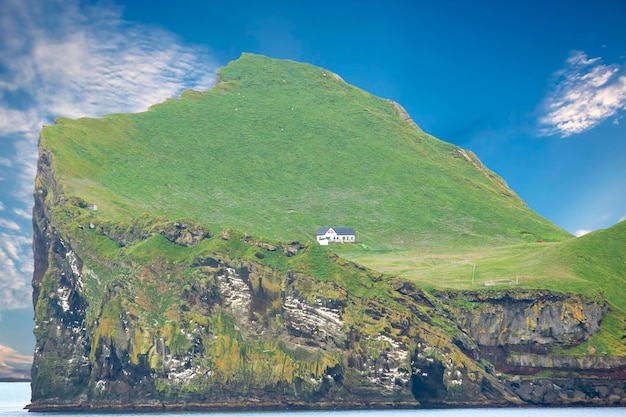 Lonely house on the Island ellidaey of the Vestmannaeyjar archipelago Iceland