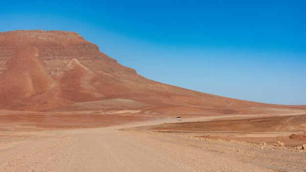 A lonely overland vehicle in the Beauty of the Namibia dessert