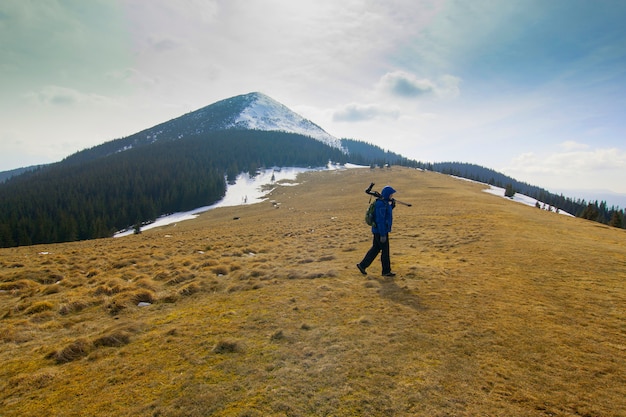 Lonely photographer in mountains