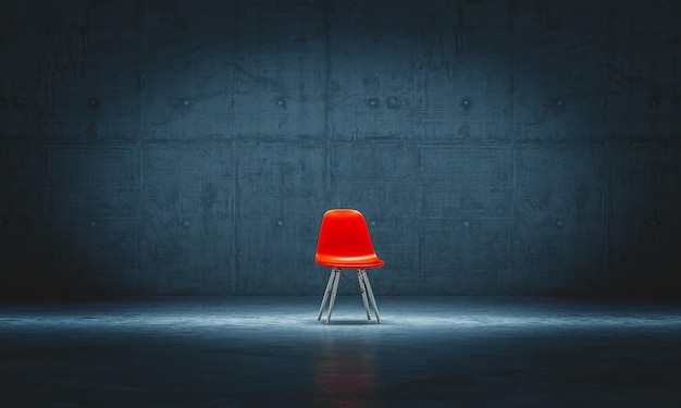 Lonely red chair in a concrete room