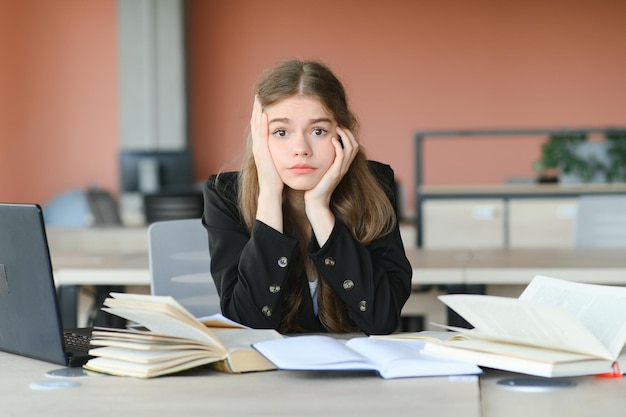 Lonely sad schoolgirl while all her classmates ignored her Social exclusion problem Bullying at school concept