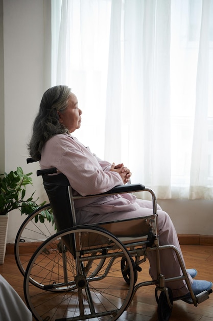 Lonely Senior Woman in Pajamas