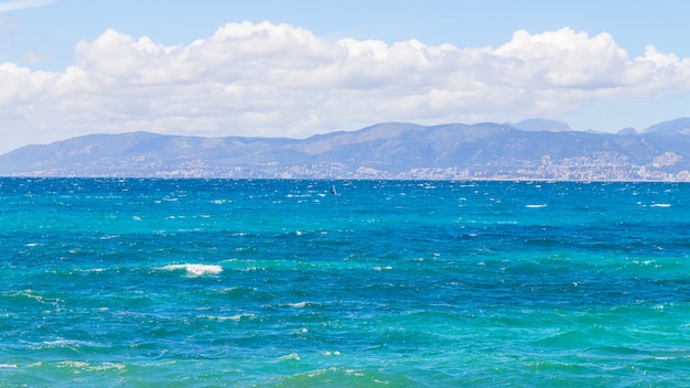 Lonely surfer in the sea