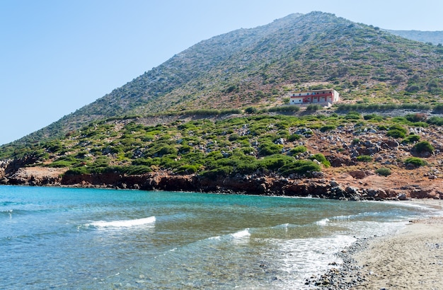 Lonely villa on the mountain near coast in Crete, Greece