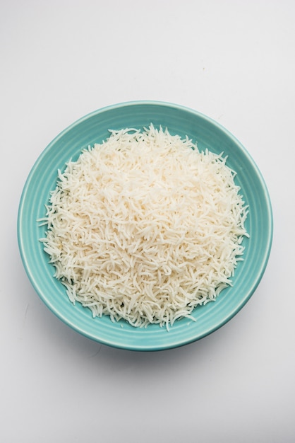 Long Basmati Rice in cooked form is an Indian main course food, served in a bowl. selective focus