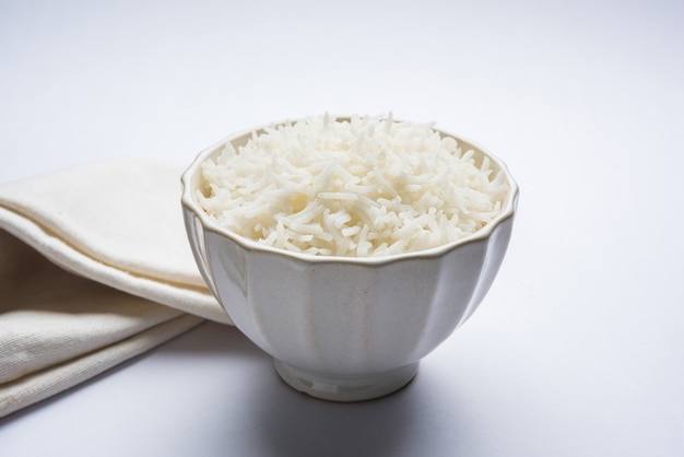 Long Basmati Rice in cooked form is an Indian main course food, served in a bowl. selective focus