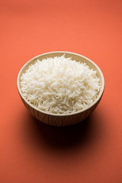 Long Basmati Rice in cooked form is an Indian main course food, served in a bowl. selective focus