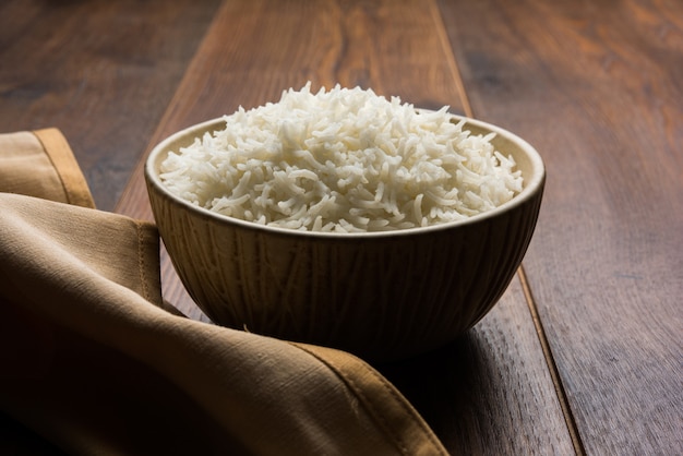 Long Basmati Rice in cooked form is an Indian main course food, served in a bowl. selective focus