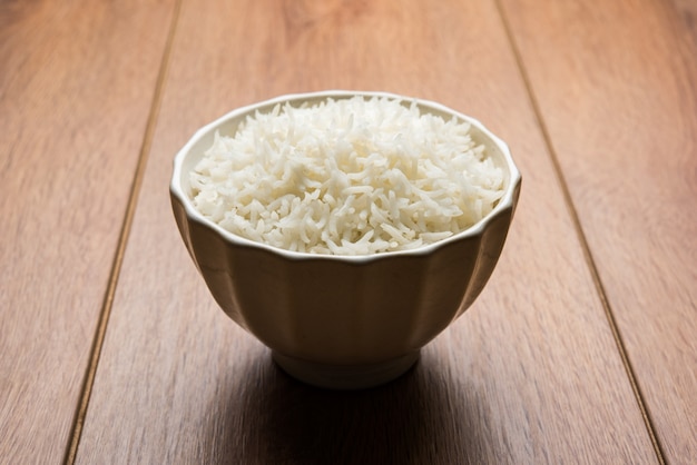 Long Basmati Rice in cooked form is an Indian main course food, served in a bowl. selective focus