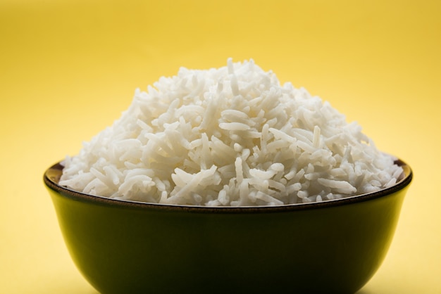 Long Basmati Rice in cooked form is an Indian main course food, served in a bowl. selective focus