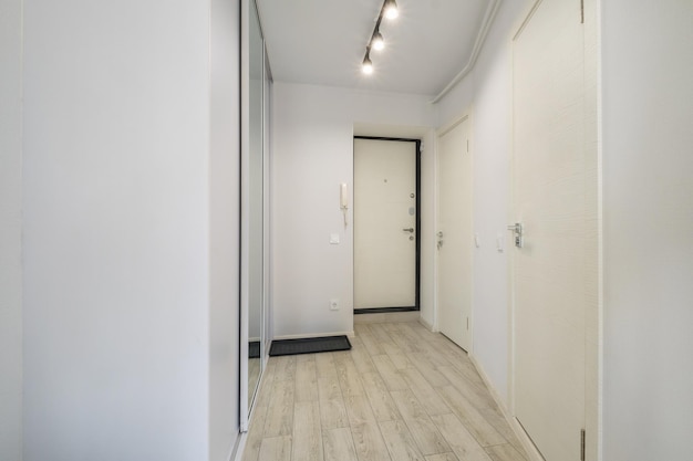 Long empty corridor in interior of entrance hall of modern\
apartments office or clinic