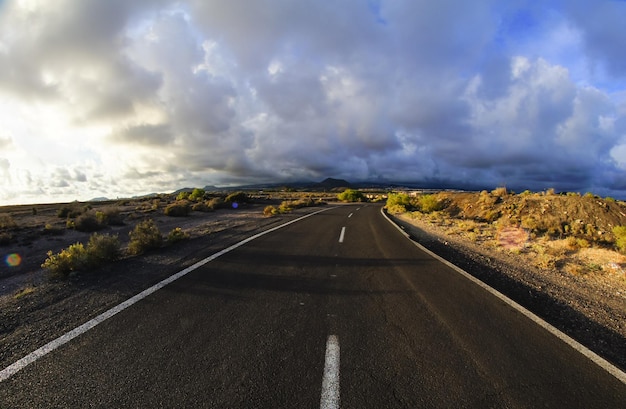 Long Empty Desert Road on a Cludy Day