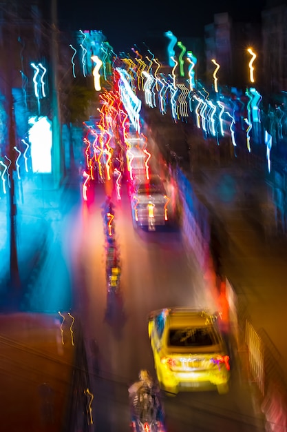 Long exposure night time traffic trails with vibrant neon colors