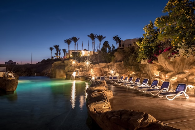 Long exposure shot of swimming pool at luxury night illumination