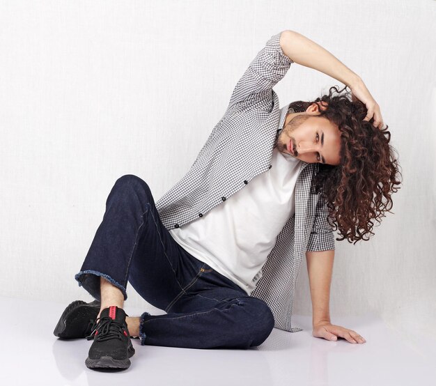 Long hair man posing in style