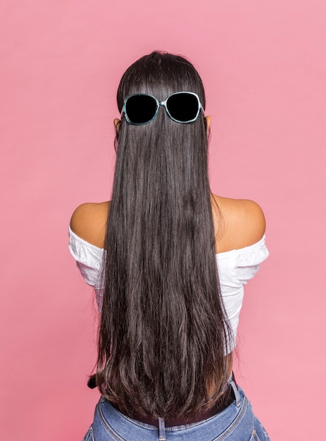 Photo long hair with sunglasses from behind