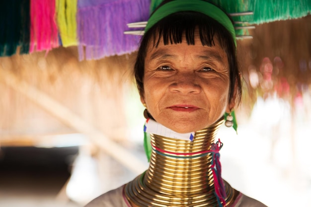 Long neck lady. Kayan Lahwi tribe known for wearing neck rings, brass coils to extend the neck.