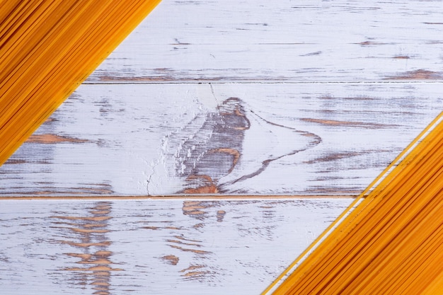 Long pasta on a white wooden background nice