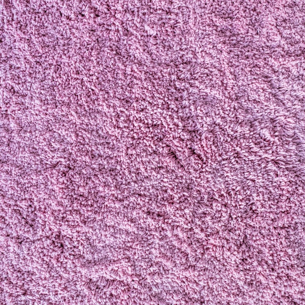 얽히고 설킨 분홍색 섬유의 긴 더미 카펫 질감 추상적 인 배경