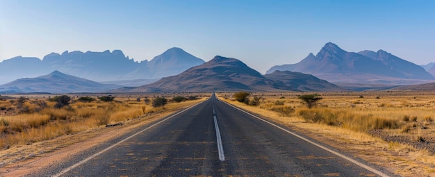 Long road in the desert mountains in the background