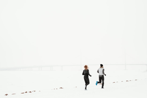long shot people running outdoors