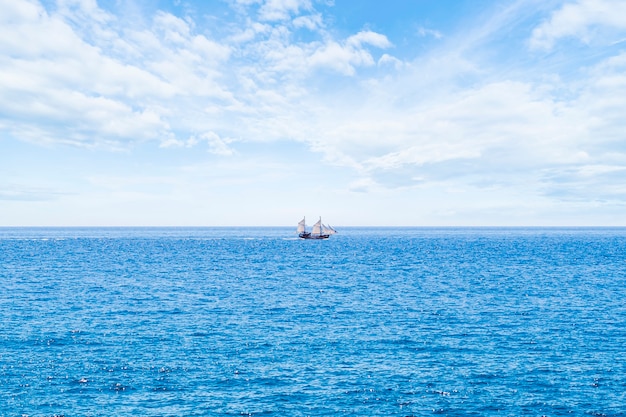 Long shot sailing boat on the sea