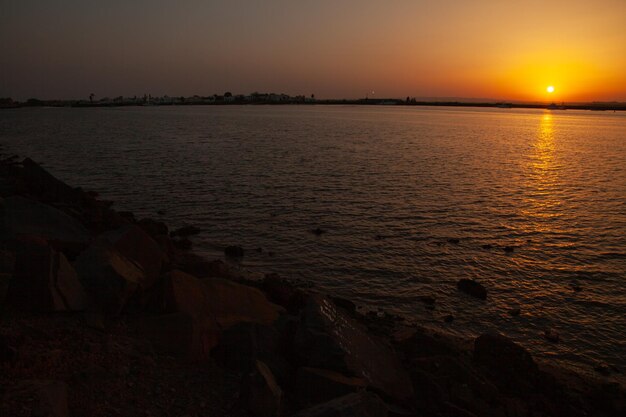 long shot of a spectacular sunset on the Spanish beach of Isla Cristina