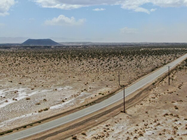 long small road in the middle of the desert in Arizona California USA