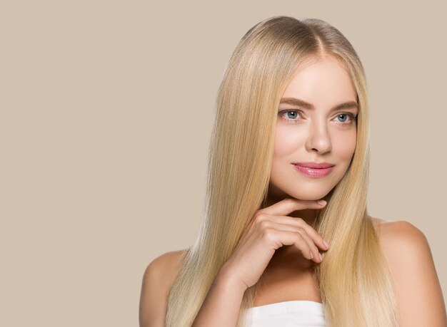 Long smooth hair beauty woman portrait blonde hairstyle healthy hair skin. color background. brown