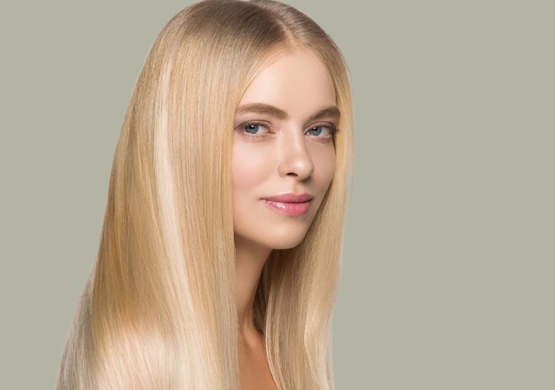 Long smooth hair beauty woman portrait blonde hairstyle healthy hair skin. Color background. Green