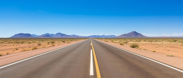 a long straight road with a yellow line on the side