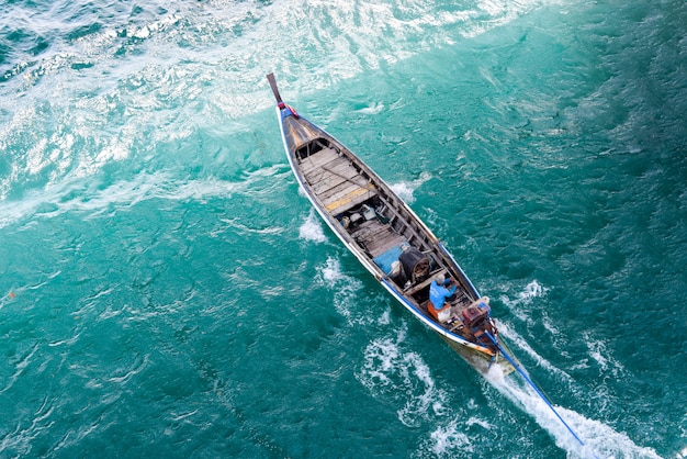 long tail boat in sea