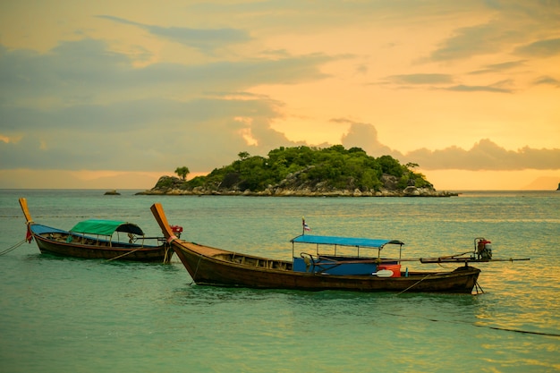 Long tail boat at sunset