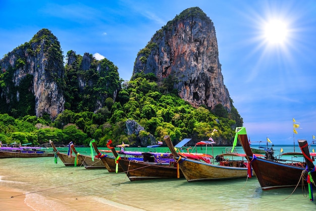 Long tail boats and rocks on Railay beach west Ao Nang Krabi