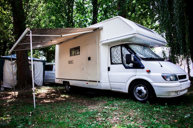 Long view of white van with tarp