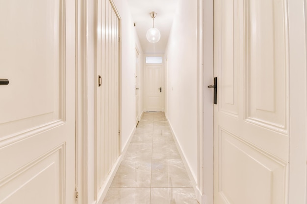 Long white corridor with marble floor