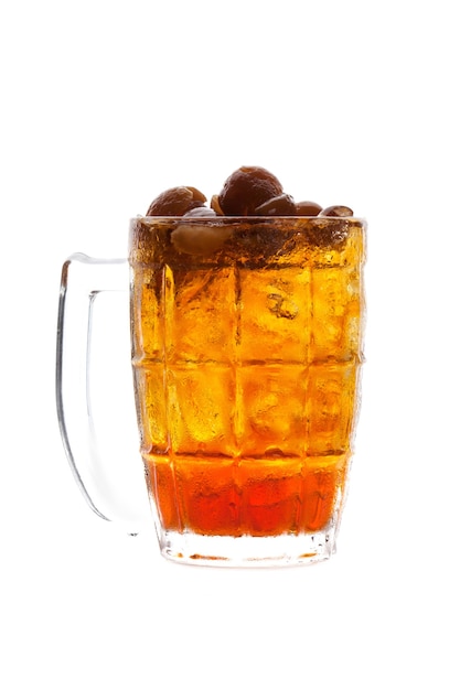 Photo longan juice with ice in glass isolated on white background.