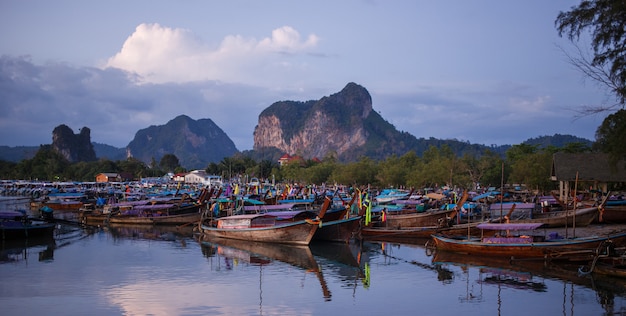 Longtail boats on sunrise.