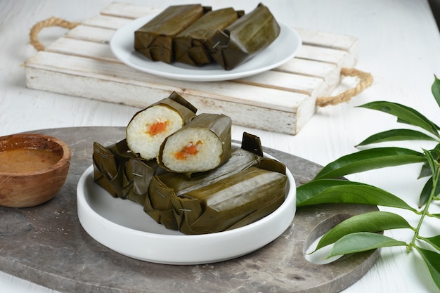 lontong isi is rice filled with oncom or vegetables and wrapped with banana leaves