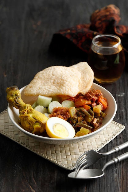 Lontong Sayur Komplit or Lontong Cap Go Meh Indonesian Rice Cake Soup for Ied Al Fitr or Ffteen Days after Lunar New Year Indonesia Peranakan Dish