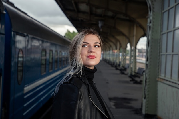 Look of a beautiful girl on the train station perone