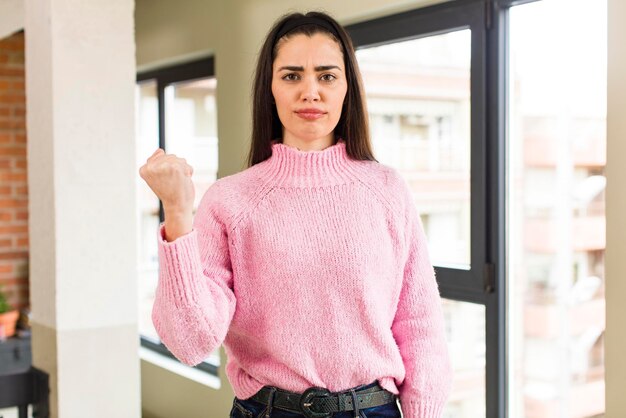 Looking confident angry strong and aggressive with fists ready to fight in boxing position