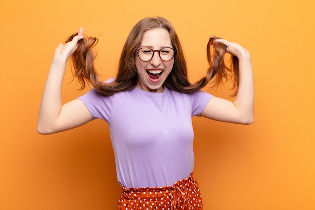 looking extremely happy and surprised, celebrating success, shouting and jumping