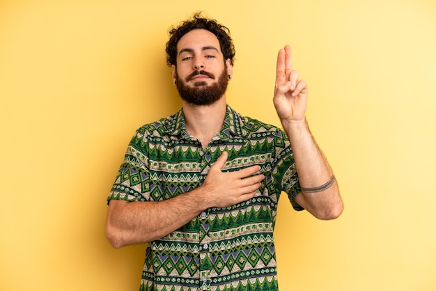 Looking happy confident and trustworthy smiling and showing victory sign with a positive attitude