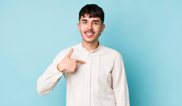 Looking happy proud and surprised cheerfully pointing to self feeling confident and lofty