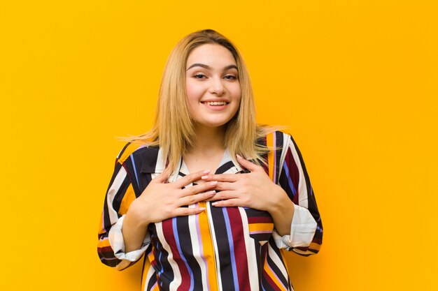 looking happy, surprised, proud and excited, pointing to self