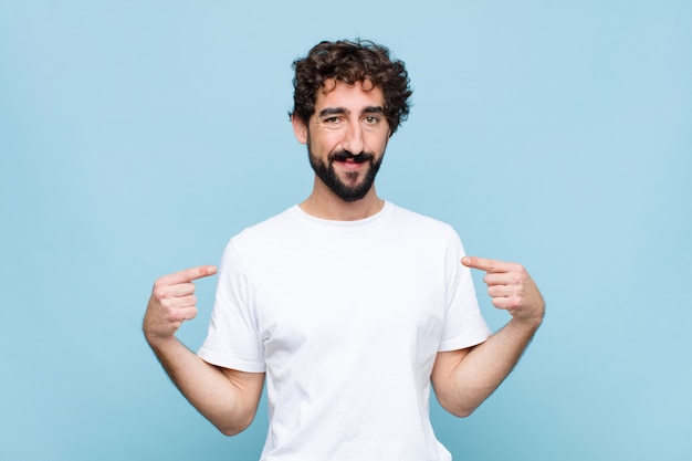 looking proud, positive and casual pointing to chest with both hands