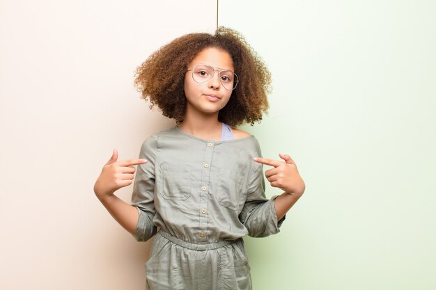 looking proud, positive and casual pointing to chest with both hands