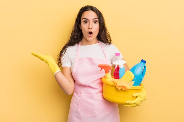 Looking surprised and shocked with jaw dropped holding an object