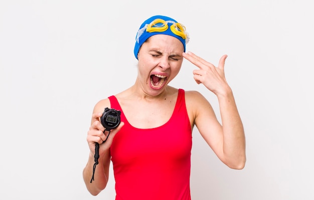 Looking unhappy and stressed suicide gesture making gun sign